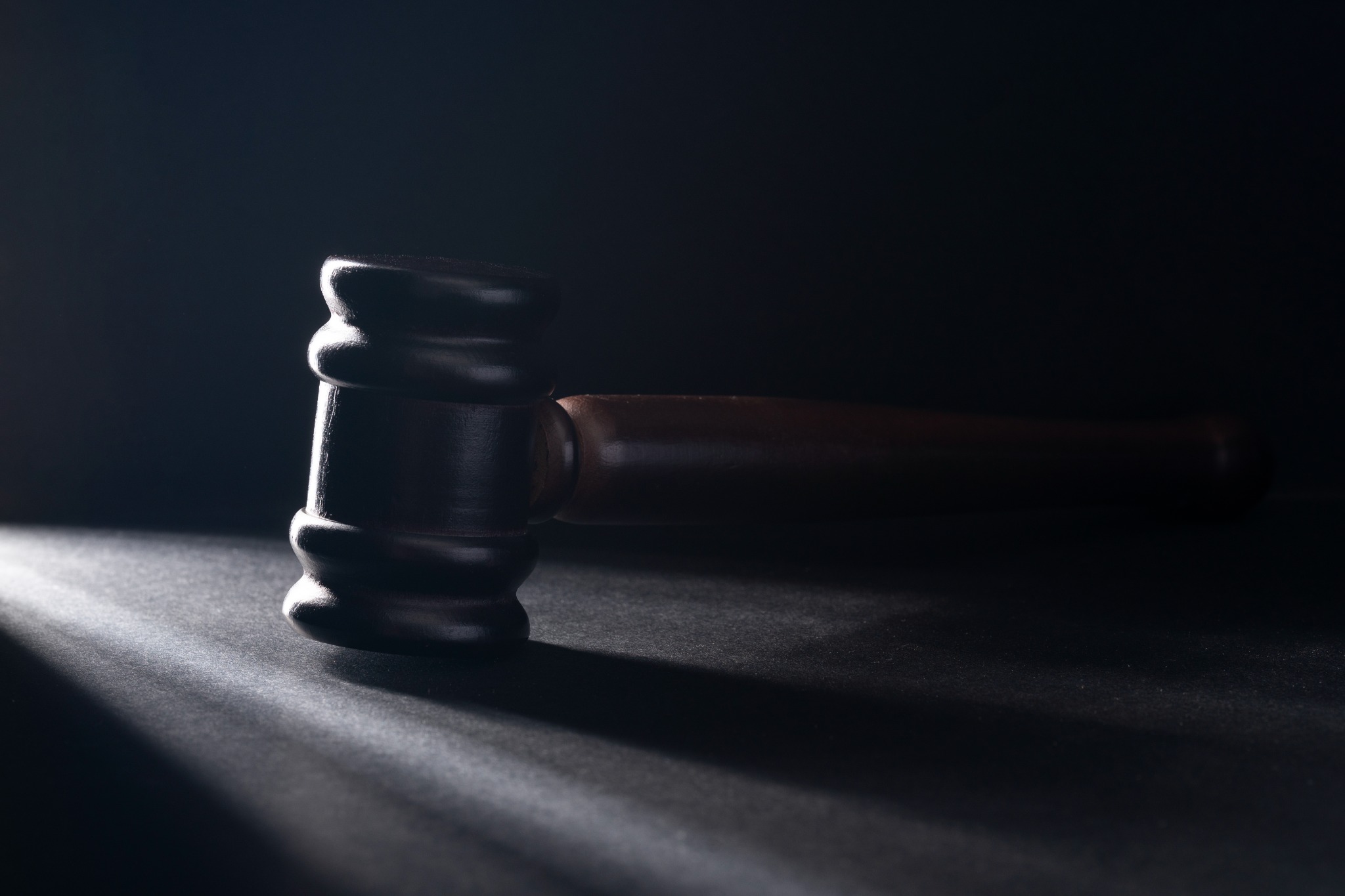 Judge's gavel on a dark background