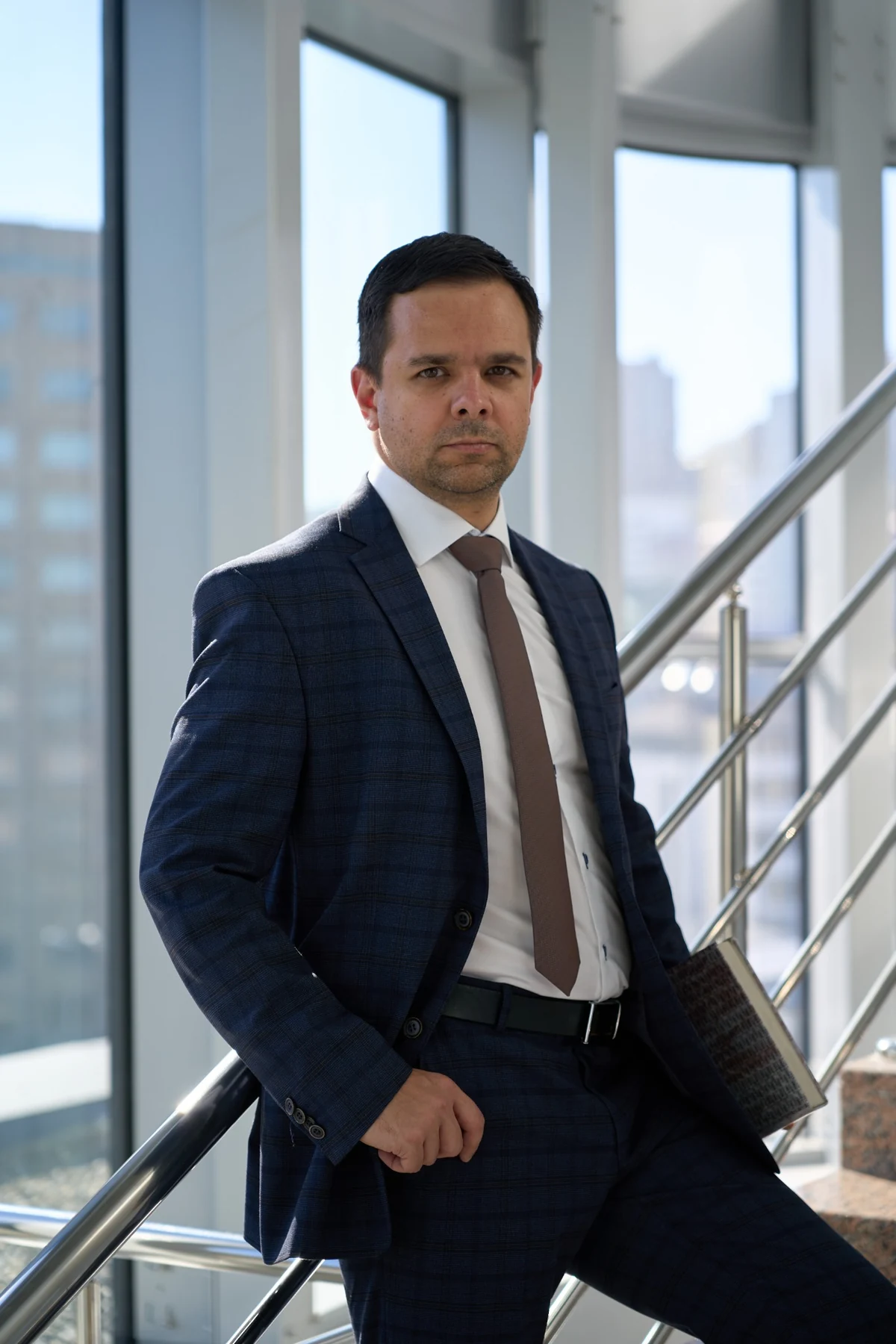 Lawyer standing beside a staircase